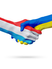 Flags Luxembourg, Ukraine countries, partnership friendship handshake concept.