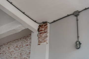 Old brick wall background with chipped paint