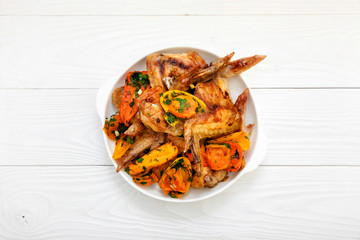 grilled chicken wings, peppers, tomatoes