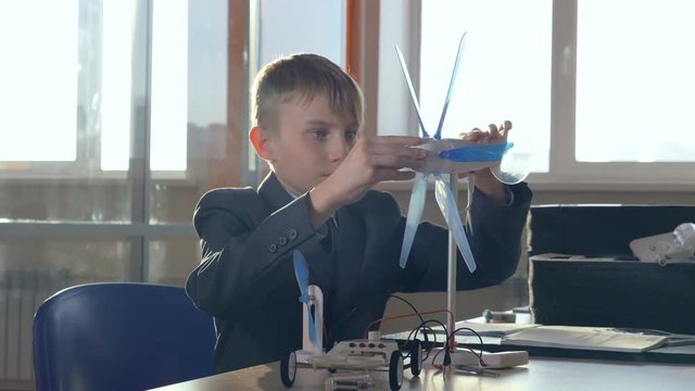 Little Genius Comprehend alternative energy. School science concept.