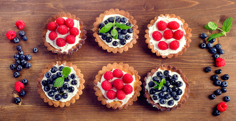 Tarts with fresh raspberries and blueberries