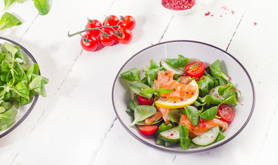 Salmon Salad with fresh vegetables. Healthy diet concept.