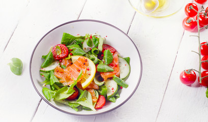 Salmon Salad with fresh vegetables. Healthy food concept.