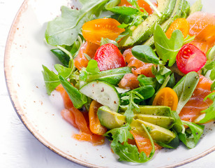 Salmon salad with cherry tomatoes,  arugula, spinach  and avocado.