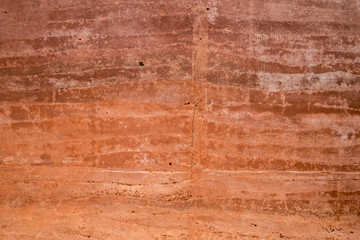 Patterned red concrete wall background