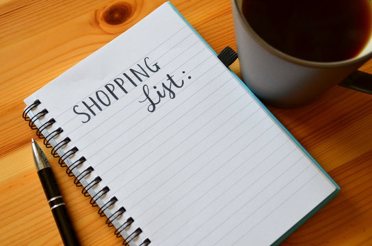 SHOPPING LIST Handwritten On Notepad On Desk