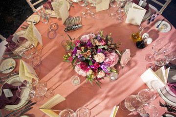 Look from above at pretty bouquet standing in the middle of dinner table