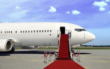 Fototapeta na wymiar Boarding commercial airplane with red carpet presentation