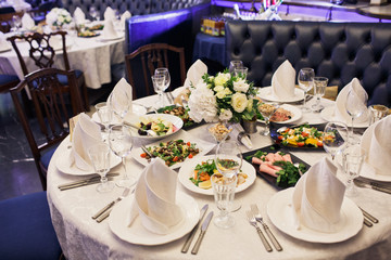 Round table served with delicious snacks