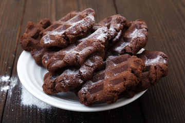 Chocolate wafers in powdered sugar