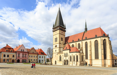 Fototapeta na wymiar Old town market square in Bardejov, Slovakia. In foreground gothic Basilica of St. Giles 