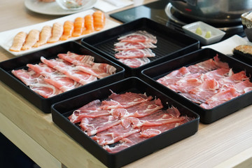 Shabu Shabu or Sukiyaki is a Japanese style and Korean style - Raw pork sliced for hot pot, Selective focus.