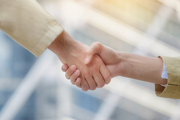 Arab businessmen shake hands and accept business deals for teamwork.