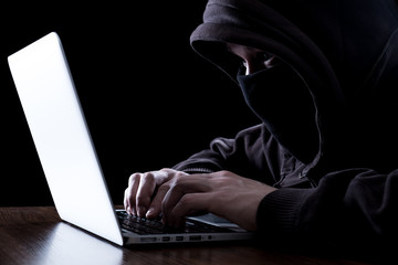 Anonymous hacker in the dark