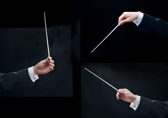 Hands of music conductor on black background.
