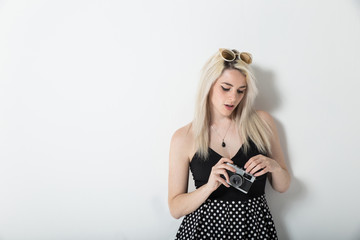 trndy hipster young woman using a photo camera