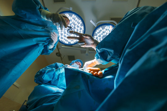 Surgeons doing an Achilles tendon surgery