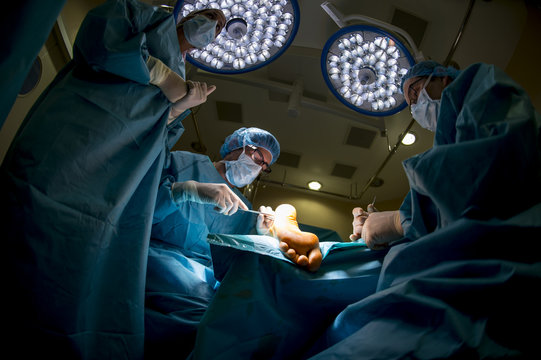 Surgeons doing an Achilles tendon surgery
