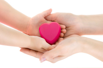 Obraz premium Mother's and daughter's hands keep heart