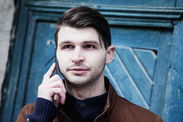 successful businessman talking on a smartphone (business, communication,  agreement concept)