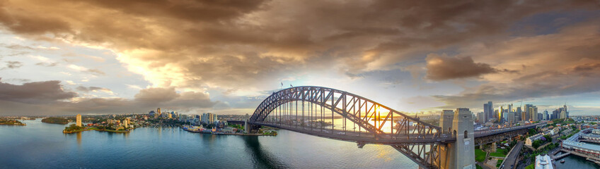 Sydney Harbour Bridge at sunset, panoramic view from the sky
