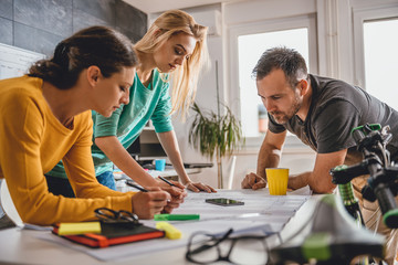 Group of people checking blueprints