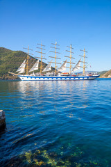 Obraz premium Beautiful sunny day in Perast, Montenegro, big sailing ship in the Kotor bay (Boka Kotorska), Montenegro, Europe.