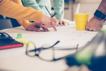 Group of people checking blueprints