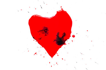 Heart symbol painted with red paint with black drops and spatter and splash around isolated on white background