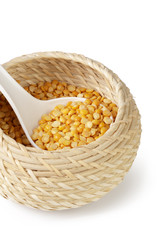 Dry yellow split peas isolated on white.