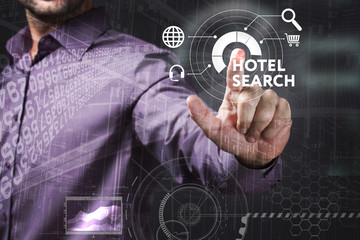 Business, Technology, Internet and network concept. Young businessman working on a virtual screen of the future and sees the inscription: Hotel search