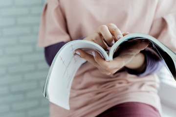 woman reading a magazine