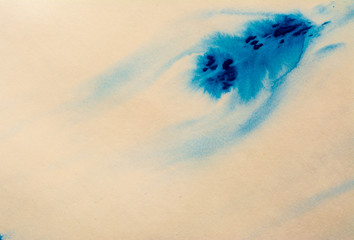 Blue paint watercolor dried on a piece of paper. Stains of blue paint on a white sheet. Abstraction of blue paint texture background. Old retro vintage style photo.