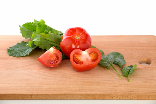 Fesh tomatoes  on the wooden background