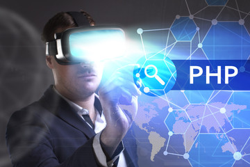 Business, Technology, Internet and network concept. Young businessman working in virtual reality glasses sees the inscription: PHP