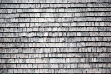 Traditional wooden shingles wall of an Austrian house.