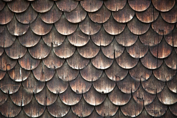 Traditional wooden shingles wall of an Austrian house.
