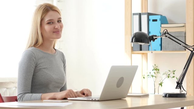Smiling Young Woman at Work