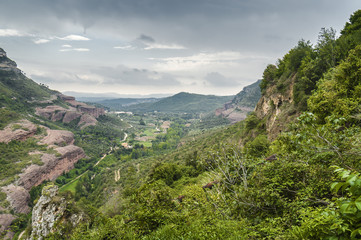 Cloudy view of monastery complex Sant Miquel del Fai not far from Barcelona, Catalonia, Spain.