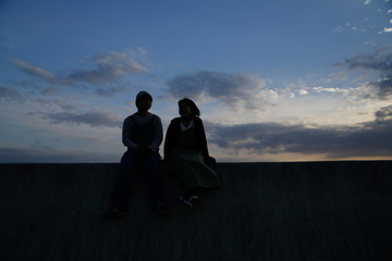 Young attractive couple at dusk