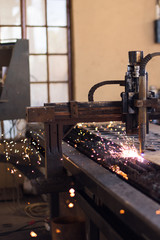 Water jet machine cutting metal shapes