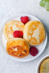 Cheesecakes with raspberry. Morning concept. Copy space