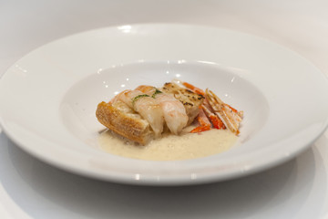 Italian seafood: dish with scampi, parsley and bread