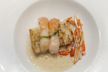 Italian seafood: dish with scampi, parsley and bread