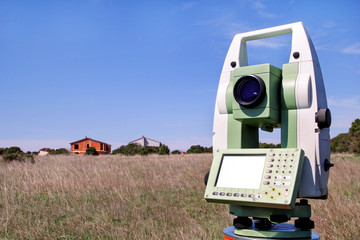Total station. Survey Instrument geodetic device. Fall time land surveying, set in field. Modern...