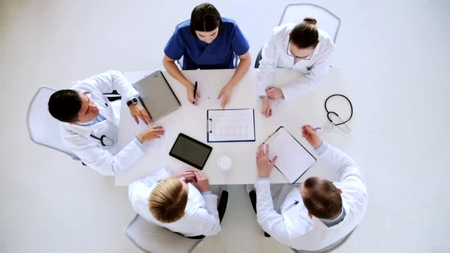 group of doctors with cardiogram at hospital