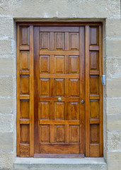 ancient wooden door in a stone wall