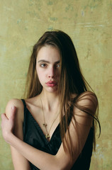 Fototapeta premium sexy woman, girl with long brunette hair in black dress
