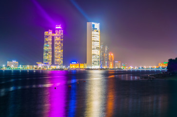 Naklejka na ściany i meble Skyline of Abu Dhabi during sunset