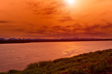 Fototapeta premium Kong river border between Thailand and Laos under the sunrise at nakhonphanom,Thailand.
